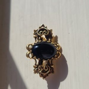 Vintage gold-colored Brooch with Black gem